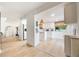 Bright eat-in kitchen featuring white cabinetry and an open concept design at 5113 Mystic Point Ct, Orlando, FL 32812