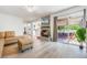 Comfortable living room with a fireplace and sliding glass doors to an outdoor space at 5113 Mystic Point Ct, Orlando, FL 32812