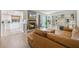 Open living space with a fireplace and a full view into the adjacent kitchen at 5113 Mystic Point Ct, Orlando, FL 32812