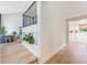 Open-concept living area with hardwood floors and staircase leading upstairs at 5113 Mystic Point Ct, Orlando, FL 32812