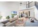 Bright living room with high ceilings, a ceiling fan, and an adjacent dining area at 5113 Mystic Point Ct, Orlando, FL 32812