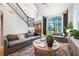 Cozy living room with large windows and a staircase; great natural light at 5113 Mystic Point Ct, Orlando, FL 32812