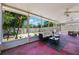 Relaxing screened patio featuring comfortable seating and view of the manicured backyard at 5113 Mystic Point Ct, Orlando, FL 32812