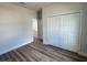 Cozy bedroom featuring wood flooring and a large closet with sliding doors at 529 Marion Oaks Ln, Ocala, FL 34473