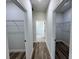 Hallway view of two walk-in closets with shelving at 529 Marion Oaks Ln, Ocala, FL 34473