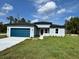 Charming home with a blue garage door, neutral paint, and well manicured lawn at 529 Marion Oaks Ln, Ocala, FL 34473