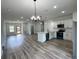 Bright kitchen with white cabinets, granite countertops, and stainless steel appliances at 529 Marion Oaks Ln, Ocala, FL 34473