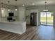Modern kitchen with white cabinets, stainless steel appliances, and a center island at 529 Marion Oaks Ln, Ocala, FL 34473