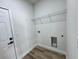 Laundry room features a shelf, hookups and laminate flooring at 529 Marion Oaks Ln, Ocala, FL 34473