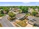 Aerial view of a lovely home featuring a large manicured lawn and mature trees at 5575 Garden Grove Cir, Winter Park, FL 32792