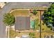 Top-down aerial shot showcasing the home and pool, backyard and landscaping at 5575 Garden Grove Cir, Winter Park, FL 32792