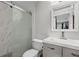 This bathroom features a glass-enclosed shower and a modern sink and vanity at 5575 Garden Grove Cir, Winter Park, FL 32792