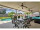 Entertain on this covered patio with a ceiling fan and view of the sparkling in-ground pool at 5575 Garden Grove Cir, Winter Park, FL 32792
