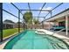 This outdoor pool is screened-in and has a spa and a large deck for entertaining at 5575 Garden Grove Cir, Winter Park, FL 32792