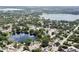A tranquil community with homes surrounding two serene lakes amidst lush greenery as seen from an aerial view at 5724 Pitch Pine Dr, Orlando, FL 32819