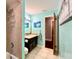 Updated bathroom featuring a tiled shower, vanity with modern fixtures, and serene paint for a tranquil atmosphere at 5724 Pitch Pine Dr, Orlando, FL 32819