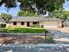 Charming single-story home with well-maintained lawn, brick accents, and a two-car garage at 5724 Pitch Pine Dr, Orlando, FL 32819