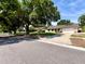 Well-maintained single-story home with a large front yard, a two-car garage and mature trees provides curb appeal at 5724 Pitch Pine Dr, Orlando, FL 32819