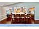 Bright eat-in kitchen boasts wooden cabinetry, stainless appliances, large island and eat-in space at 5724 Pitch Pine Dr, Orlando, FL 32819