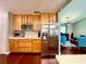This bright kitchen offers stainless appliances, wood cabinets, lots of counter space, and an open floorplan at 5724 Pitch Pine Dr, Orlando, FL 32819