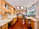 This expansive kitchen features wood cabinets, lots of counter space, and stainless steel appliances at 5724 Pitch Pine Dr, Orlando, FL 32819