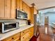 Bright kitchen offers stainless steel appliances, wooden cabinets, and plenty of counter space for cooking at 5724 Pitch Pine Dr, Orlando, FL 32819