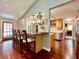 Spacious kitchen features stainless appliances, eat-in bar, and is adjacent to the dining room and laundry room at 5724 Pitch Pine Dr, Orlando, FL 32819