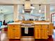 This open kitchen boasts stainless appliances, plenty of counter space, and an eat-in bar that flows into living area at 5724 Pitch Pine Dr, Orlando, FL 32819