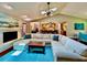 Spacious living area with a fireplace and a clear view of the adjacent kitchen and dining area at 5724 Pitch Pine Dr, Orlando, FL 32819