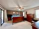 Spacious main bedroom with lots of natural light, ceiling fan, and access to the backyard at 5724 Pitch Pine Dr, Orlando, FL 32819