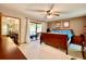 Main bedroom includes ceiling fan, neutral carpet, and access to the pool via sliding glass doors at 5724 Pitch Pine Dr, Orlando, FL 32819