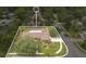 Delineated aerial showcases property with pool, landscaping, and surrounding community at 603 S Sweetwater Blvd, Longwood, FL 32779