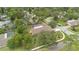 A high angle view of a property with screened pool and tree-lined street at 603 S Sweetwater Blvd, Longwood, FL 32779