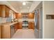 Updated kitchen featuring stainless steel appliances and granite countertops at 603 S Sweetwater Blvd, Longwood, FL 32779
