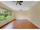 Bright and airy living area showcasing hardwood floors, ceiling fans, and lots of natural light at 603 S Sweetwater Blvd, Longwood, FL 32779