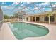 Stunning pool with large screened-in enclosure and outdoor lounge area at 603 S Sweetwater Blvd, Longwood, FL 32779