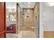 Bathroom boasts a large shower with river rock floor and custom tile accents at 603 S Sweetwater Blvd, Longwood, FL 32779
