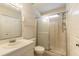 Bathroom with shower and tub combo, white vanity and sliding glass door at 620 Unabelle Ave, Holly Hill, FL 32117