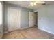Bedroom with closet, tile flooring and ceiling fan at 620 Unabelle Ave, Holly Hill, FL 32117