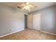 Light-filled bedroom featuring neutral walls, tile floors, a ceiling fan, and closet at 620 Unabelle Ave, Holly Hill, FL 32117