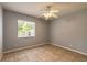 Bedroom with tile flooring, ceiling fan and window at 620 Unabelle Ave, Holly Hill, FL 32117