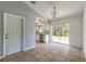 Dining area with tile floors and sliding glass doors leading to the backyard at 620 Unabelle Ave, Holly Hill, FL 32117