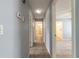 Hallway with tile flooring leading to bathroom and bedrooms at 620 Unabelle Ave, Holly Hill, FL 32117