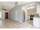 Spacious room with tile floors, kitchen access, and a view of the front door at 620 Unabelle Ave, Holly Hill, FL 32117