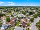 Aerial view of a residential neighborhood showcasing diverse homes with lush landscaping and well-maintained streets at 754 Birgham Pl, Lake Mary, FL 32746