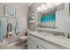 Charming bathroom featuring a double sink vanity with granite and mermaid-themed wall decor at 754 Birgham Pl, Lake Mary, FL 32746