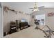 Functional bedroom featuring a vaulted ceiling, workspace, and shelving with photos at 754 Birgham Pl, Lake Mary, FL 32746