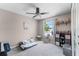 Bright bedroom featuring a ceiling fan, neutral walls and a window view of the outside at 754 Birgham Pl, Lake Mary, FL 32746