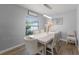 Elegant dining room with a large window offering lots of natural light at 754 Birgham Pl, Lake Mary, FL 32746