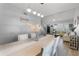 Open-concept space blending a dining area with a view into the living room and stairs at 754 Birgham Pl, Lake Mary, FL 32746